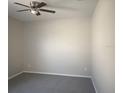 Simple bedroom with grey carpet and neutral walls at 2887 Sweetspire Cir, Kissimmee, FL 34746
