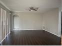 Spacious living room featuring dark hardwood floors at 2887 Sweetspire Cir, Kissimmee, FL 34746