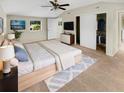 Main bedroom with a king-size bed, ceiling fan, and large closet at 326 Banyan Dr, Maitland, FL 32751