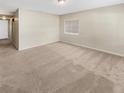 Large living room with neutral colored carpet and ample space at 326 Banyan Dr, Maitland, FL 32751