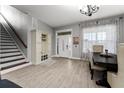 Bright dining area with hardwood floors and chandelier at 5039 Ne 125Th Loop, Oxford, FL 34484
