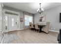 Dining room with hardwood floor, chandelier, and art at 5039 Ne 125Th Loop, Oxford, FL 34484