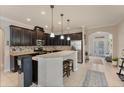 Open kitchen features granite countertops and dark wood cabinets at 3466 Halsway Dr, Orlando, FL 32824