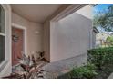 Welcoming front entry with brick walkway and well-maintained landscaping at 8316 Fontera Dr, Davenport, FL 33896