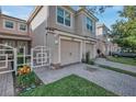 Townhouse with two-car garage and inviting front entrance at 8316 Fontera Dr, Davenport, FL 33896