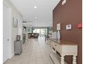 Bright and spacious entryway with views into the living room and kitchen at 7713 Graben St, Kissimmee, FL 34747