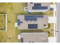 Aerial view highlighting solar panels on the roof at 522 Jett Ln, Davenport, FL 33837