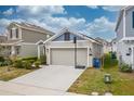 House exterior showcasing a two-car garage and driveway at 522 Jett Ln, Davenport, FL 33837
