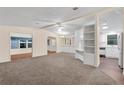 Open living area with a view into the kitchen and dining area at 538 Saint Andrews Blvd, The Villages, FL 32159