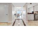 Open concept entryway leading to living and dining areas at 7593 Gathering Dr # 505, Reunion, FL 34747