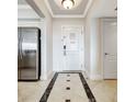 Elegant entryway with tile flooring and access to kitchen at 7593 Gathering Dr # 505, Reunion, FL 34747