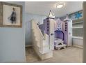 bedroom with Frozen themed decor and a custom castle bunk bed at 3545 Lavender Dr, Davenport, FL 33897