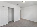 Simple bedroom with gray carpet and a large closet at 1353 Hanoverian Dr, Lake Alfred, FL 33850