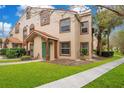 Townhouse exterior with walkway and landscaping at 5460 E Michigan St # 7, Orlando, FL 32812