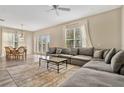 Spacious living area with comfortable seating and a dining area at 7768 Linkside Loop, Reunion, FL 34747