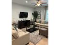 Spacious living room with comfy sofas and TV at 370 Lasso Dr, Kissimmee, FL 34747