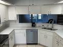 Modern kitchen featuring stainless steel appliances and ample counter space at 6065 Dory Way, Tavares, FL 32778