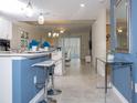 Open concept kitchen with island and breakfast bar at 4721 Clock Tower Dr # 304, Kissimmee, FL 34746