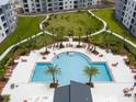 Community swimming pool with ample surrounding deck space at 3180 Paradox Circle # 203, Kissimmee, FL 34746