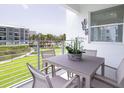 Relaxing patio with outdoor furniture overlooking a pool at 3180 Paradox Circle # 203, Kissimmee, FL 34746