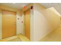 Building hallway with carpet and neutral walls at 155 S Court Ave # 1704, Orlando, FL 32801