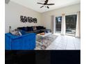 Living room with sectional sofa and access to pool at 4564 Ada Ln, Kissimmee, FL 34746
