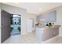Kitchen with light blue cabinets and granite countertops at 4564 Ada Ln, Kissimmee, FL 34746