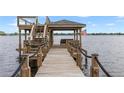 Expansive wooden dock with gazebo, perfect for lakefront living at 208 Green Lake Cir, Longwood, FL 32779