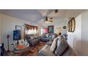 Living room with two large sofas, a large TV, and decorative items at 420 Albatross Ct, Poinciana, FL 34759