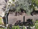 Aerial view of townhome roofs and surrounding landscape at 4945 Sanoma Vlg # B, Orlando, FL 32808