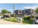 Condo unit with wood shake roof and carport at 2920 Pecan Ave, Leesburg, FL 34748