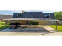 Carport with parking spaces and a black SUV parked under it at 2920 Pecan Ave, Leesburg, FL 34748