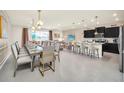 Modern kitchen with island and stainless steel appliances at 4289 Lana Ave, Davenport, FL 33897