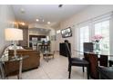 Open living room and kitchen with a dining table and sofa at 2208 San Vittorino Cir # 101, Kissimmee, FL 34741