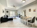 Open living and dining area with contemporary furniture at 9055 Treasure Trove Ln # 204, Kissimmee, FL 34747