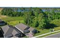 Birds-eye view showcasing the home's location near a serene lake at 17404 Lake Star Rd, Winter Garden, FL 34787