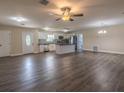 Open floor plan living room with kitchen and island at 2600 Park Ave, Indian Lake Estates, FL 33855