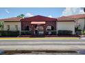 Community entrance with brick archways and lush landscaping at 1609 Long Ridge Ct # 1609, Orlando, FL 32807