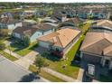 Single-story house on a tree-lined street in a residential neighborhood at 196 Aidans Lndg, Haines City, FL 33844