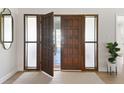Elegant entryway with a large wood door and sidelights at 4041 Yacht Ct, Winter Park, FL 32792