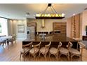Modern kitchen with large island, stainless steel appliances, and wood cabinets at 7484 Brooklyn Dr, Kissimmee, FL 34747