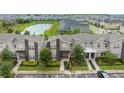 Community of townhouses near a pond at 770 Pebble Beach Dr, Davenport, FL 33896