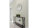Bright entryway with console table and mirror at 770 Pebble Beach Dr, Davenport, FL 33896