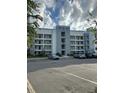 Exterior view of building with parking lot at 3131 Paradox Cir # 206, Kissimmee, FL 34746