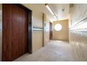 Building hallway with elevators and tiled floors at 701 S Atlantic Ave # 508, Daytona Beach, FL 32118