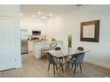 Modern dining area with glass table and chairs at 1738 Pacific Rd, Kissimmee, FL 34759