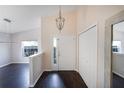 Bright entryway with dark hardwood floors, and white doors at 221 Rosa Ave, Oviedo, FL 32765