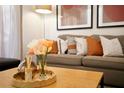 Wooden coffee table with flowers and decorative objects at 3004 Red Ginger Rd, Kissimmee, FL 34747