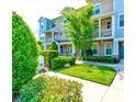 Townhouse exterior with well-maintained landscaping at 590 Piazza Pt, Oviedo, FL 32765