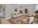 Bright living room with comfy seating, large rug, and stylish decor at 590 Piazza Pt, Oviedo, FL 32765